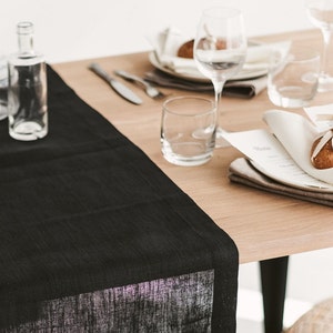 Sleek black linen table runner – perfect centerpiece for Halloween décor, holiday feasts, or an elegant wedding table. Made from sustainable, natural linen for long-lasting beauty. A luxurious and thoughtful gift for Christmas, birthdays, or new homeowners who love refined, modern home styling.