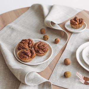 Elegant natural linen table runner in white herringbone, ideal for rustic wedding receptions, Christmas and Thanksgiving Day gatherings, or everyday dining. A soft, minimalist accent that brings warmth and charm to any holiday dinner or celebration. Thoughtfully handmade by Thing Stories.
