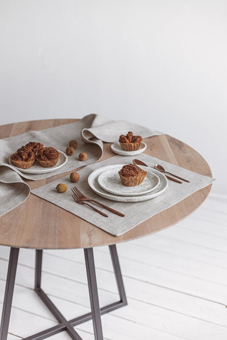 White herringbone linen table runner from Thing Stories – the perfect touch for a rustic wedding, Mother's Day, or festive Christmas table decor. Made of high-quality natural linen, it complements Thanksgiving Day table settings and birthday celebrations with simple, modern elegance.