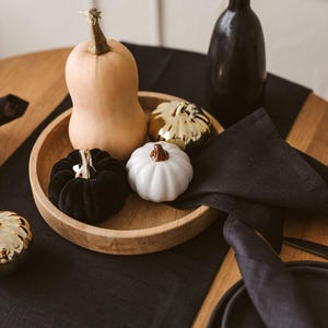 Elegant black natural linen table runner perfect for Halloween, Christmas, and Thanksgiving table settings. Adds a sophisticated, modern touch to weddings or formal dinners. A timeless and luxurious gift idea for housewarming or a new home, blending natural charm with bold, minimal style.