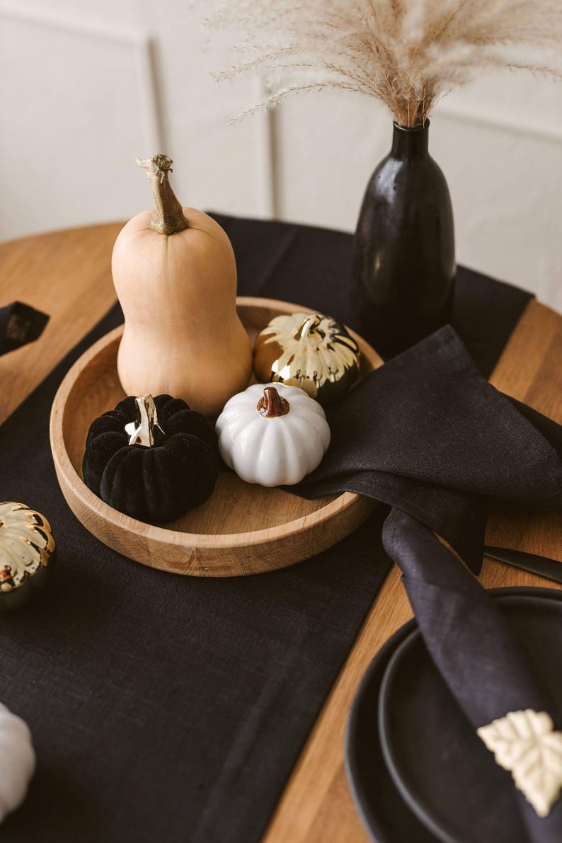 Elegant black natural linen table runner perfect for Halloween, Christmas, and Thanksgiving table settings. Adds a sophisticated, modern touch to weddings or formal dinners. A timeless and luxurious gift idea for housewarming or a new home, blending natural charm with bold, minimal style.