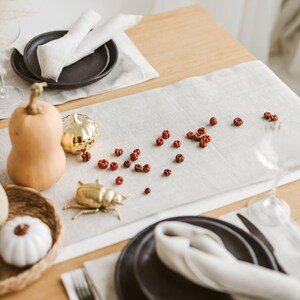 This elegant white linen table runner makes a perfect housewarming gift or timeless addition to a modern, minimalist kitchen or dining room.