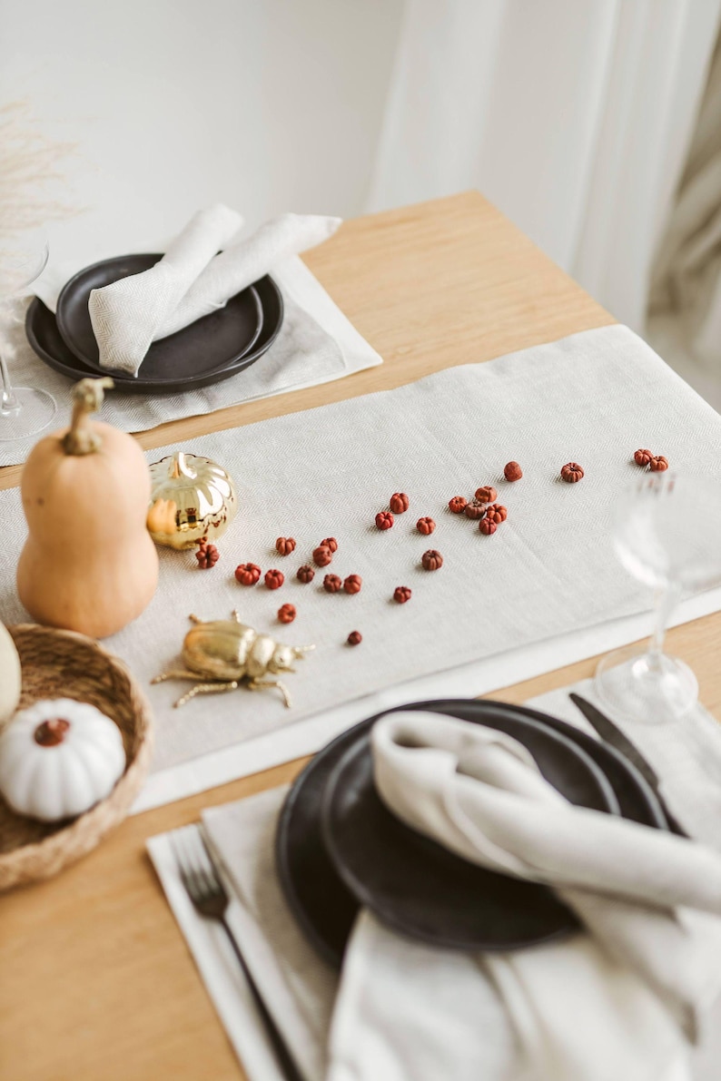 This elegant white linen table runner makes a perfect housewarming gift or timeless addition to a modern, minimalist kitchen or dining room.