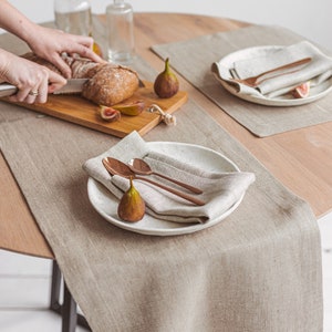 Handmade natural linen table runner from Thing Stories, ideal for creating a warm, rustic wedding atmosphere or dressing up your table for Christmas, Thanksgiving, or any holiday dinner. A minimalist, earthy choice for birthdays, Mother's Day, and everyday gatherings.
