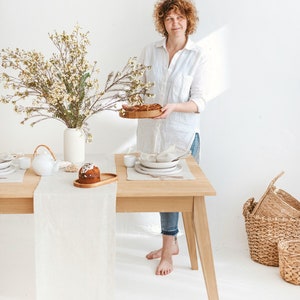 Modern white linen table runner in herringbone pattern, perfect for rustic weddings, Christmas table decor, or a cozy Thanksgiving Day table setting. Handmade from natural linen, it adds elegance to holiday dinners, birthday parties, or Mother's Day brunch. A timeless table accent by Thing Stories.