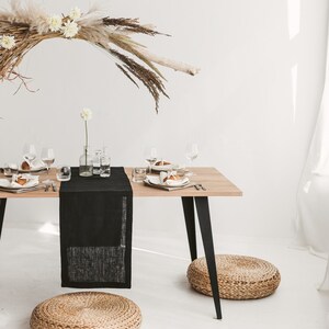 Sleek black linen table runner – perfect centerpiece for Halloween décor, holiday feasts, or an elegant wedding table. Made from sustainable, natural linen for long-lasting beauty. A luxurious and thoughtful gift for Christmas, birthdays, or new homeowners who love refined, modern home styling.