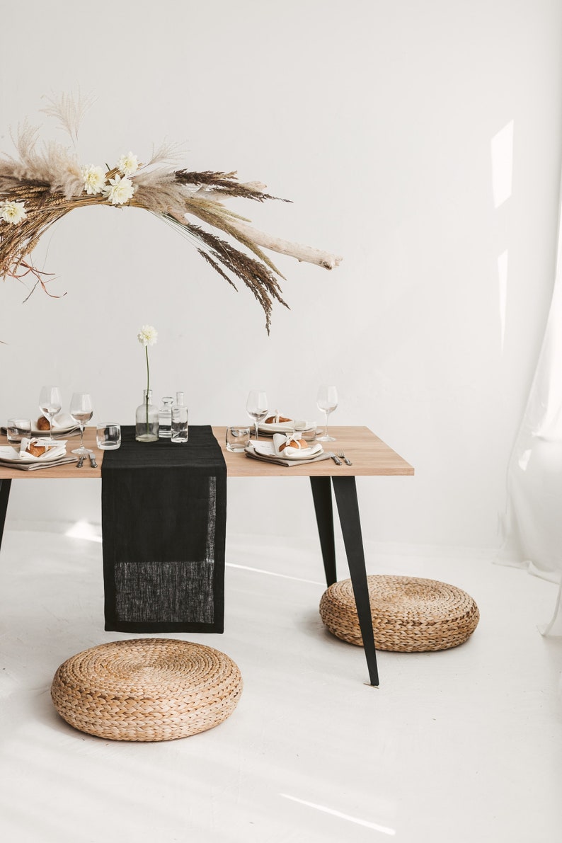 Sleek black linen table runner – perfect centerpiece for Halloween décor, holiday feasts, or an elegant wedding table. Made from sustainable, natural linen for long-lasting beauty. A luxurious and thoughtful gift for Christmas, birthdays, or new homeowners who love refined, modern home styling.