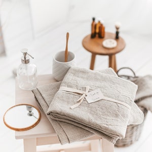 Thing Stories natural linen waffle bath towel, beach sheet, set of hand towels. Towels are lightweight, quick-dry, and quick absorbent.