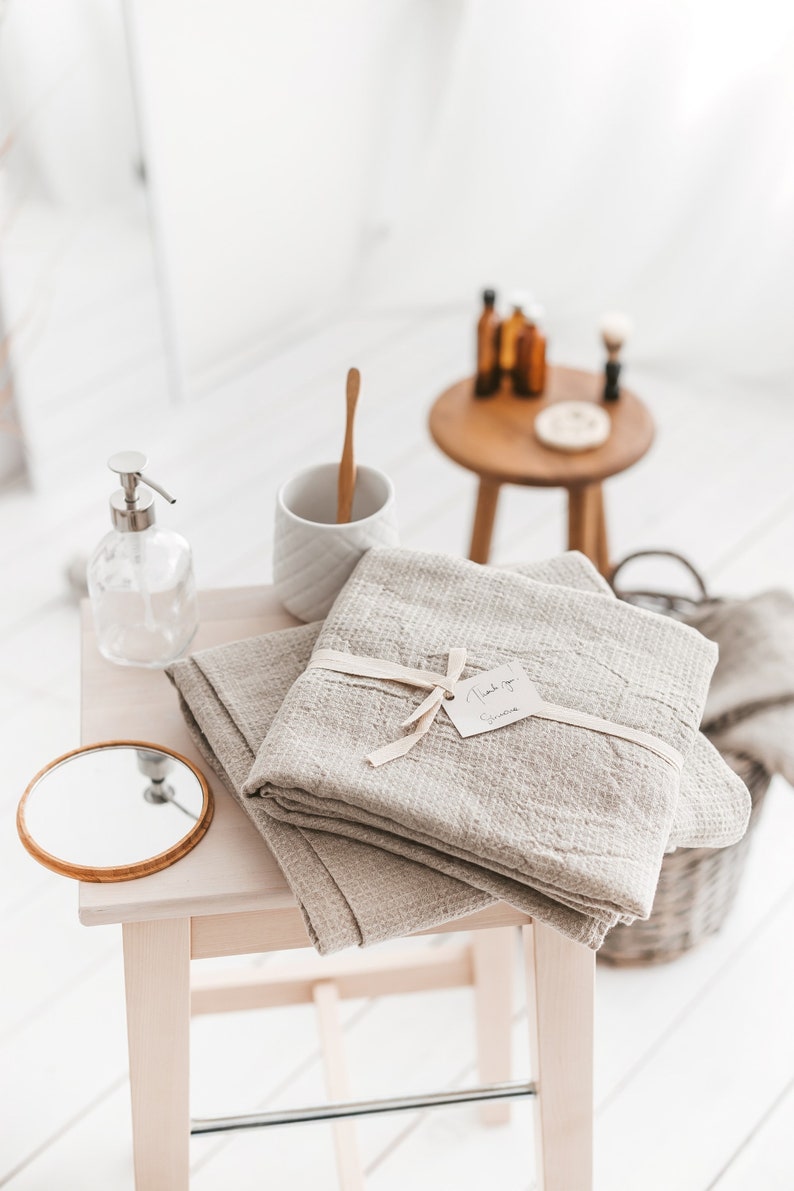 Thing Stories natural linen waffle bath towel, beach sheet, set of hand towels. Towels are lightweight, quick-dry, and quick absorbent.