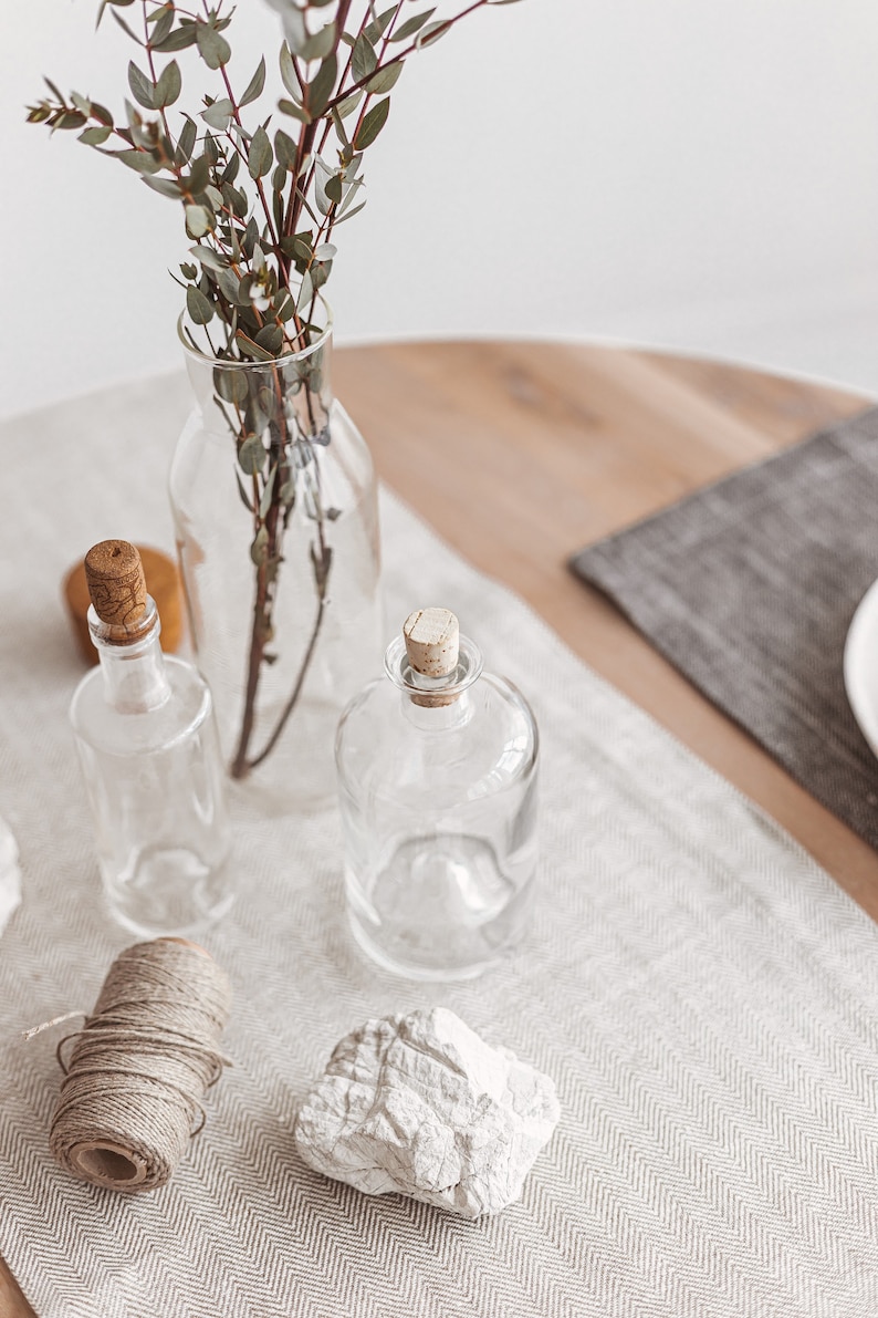 Elegant natural linen table runner in white herringbone, ideal for rustic wedding receptions, Christmas and Thanksgiving Day gatherings, or everyday dining. A soft, minimalist accent that brings warmth and charm to any holiday dinner or celebration. Thoughtfully handmade by Thing Stories.