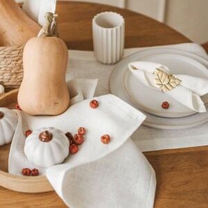 This elegant white linen table runner makes a perfect housewarming gift or timeless addition to a modern, minimalist kitchen or dining room.