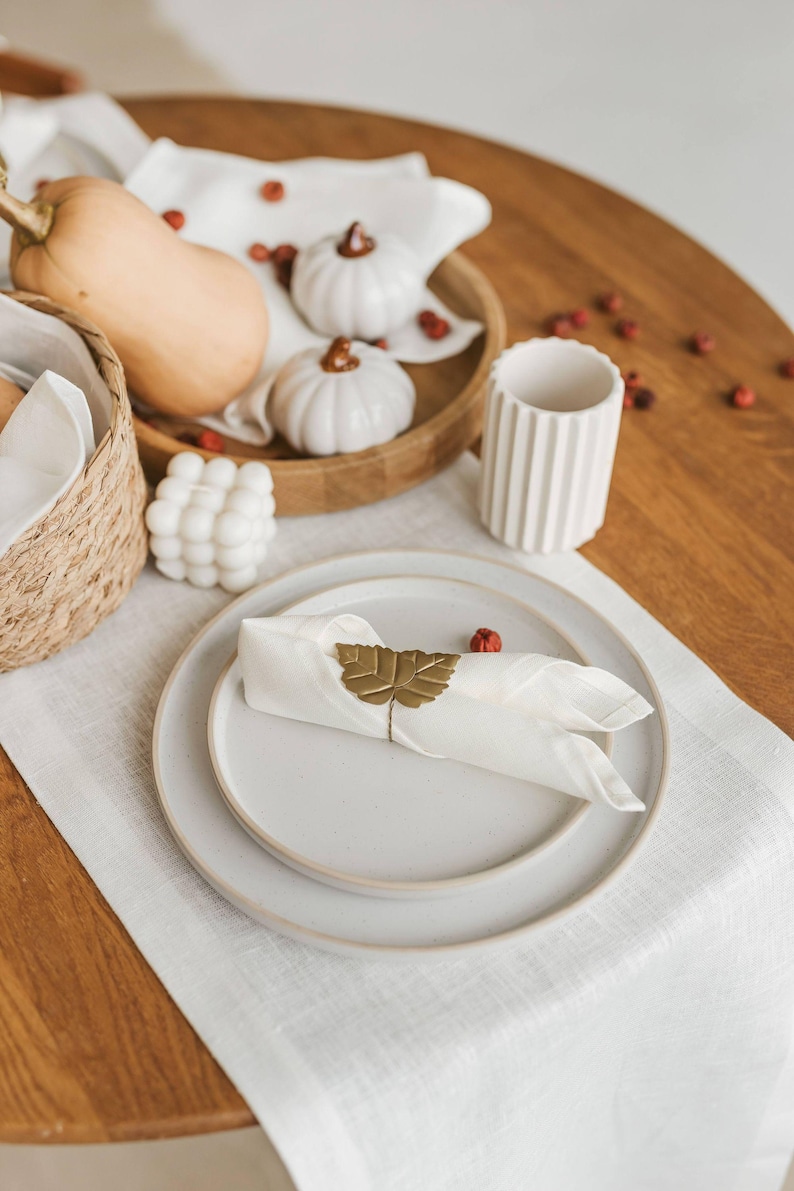 This elegant white linen table runner makes a perfect housewarming gift or timeless addition to a modern, minimalist kitchen or dining room.