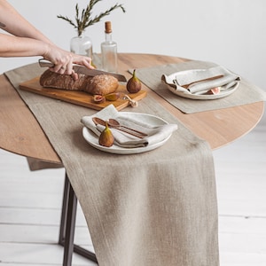 Handmade natural linen table runner from Thing Stories, ideal for creating a warm, rustic wedding atmosphere or dressing up your table for Christmas, Thanksgiving, or any holiday dinner. A minimalist, earthy choice for birthdays, Mother's Day, and everyday gatherings.