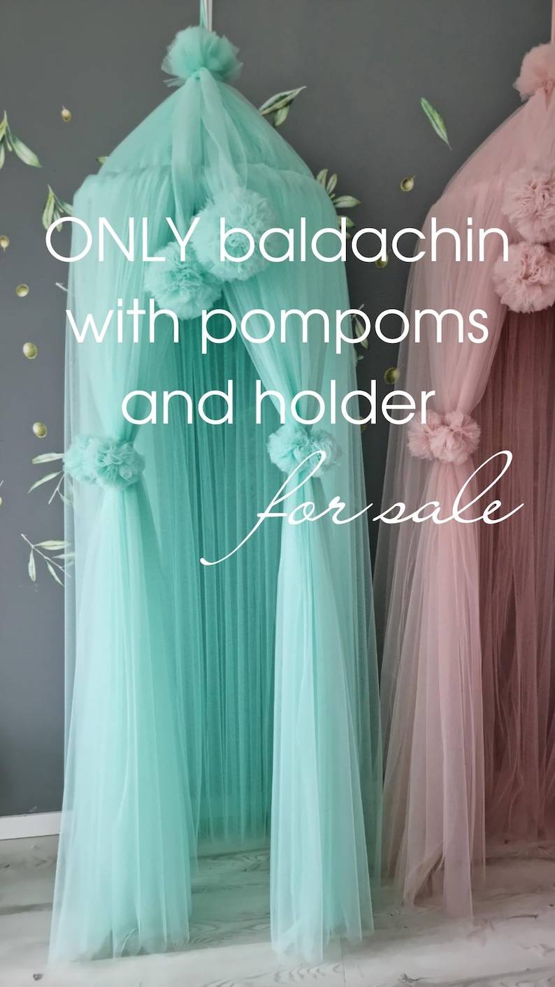 May include: Two tulle canopy bed canopies with pom poms and holders. One canopy is light blue and the other is pink. The text "ONLY baldaquin with pompoms and holder For sale" is visible in the image.