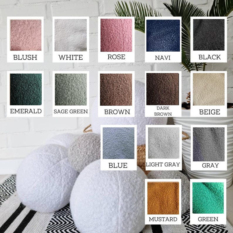 May include: A collection of 16 round, fluffy, faux fur throw pillows in various colors, including blush, white, rose, navy, black, emerald, sage green, brown, dark brown, beige, blue, light gray, gray, mustard, and green.
