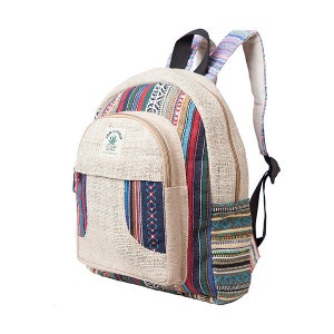 May include: A beige hemp backpack with a front pocket and colourful striped and patterned accents. The backpack has adjustable straps and a small tag with text and a leaf graphic. The bag is designed for carrying items.