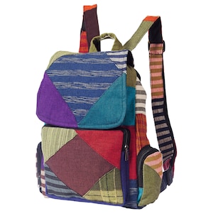 May include: A multi-coloured patchwork backpack with a zipped pocket on the front. The backpack has a variety of colours including red, blue, green, purple, and brown.