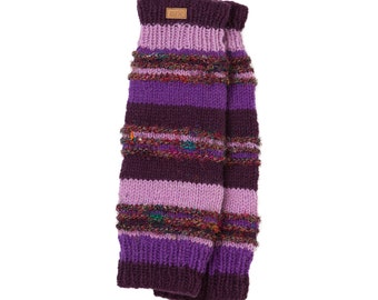 May include: A pair of knitted leg warmers in shades of purple and lavender. The leg warmers feature horizontal stripes and textured bands with colorful threads. A small brown tag with the letters "ark" is sewn on the top.