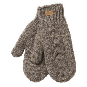 May include: A pair of grey knitted mittens with a cable knit pattern on one side. A small brown leather tag with the word "ark" is sewn on the cuff. The mittens are made of a thick, warm yarn, perfect for cold weather.
