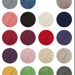 May include: A collection of colorful yarn skeins in various shades, including white, pink, purple, orange, yellow, blue, green, and gray. Each ball of yarn is neatly wound, perfect for knitting or crocheting projects.