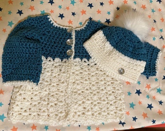 Adorable blue and white crocheted  baby sweater and hat set with crystal buttons and fur tousle.