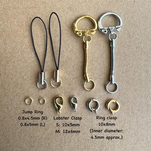 May include: Assortment of gold and silver keychains and jump rings.  The keychains include a lobster clasp, a ring clasp, and a chain with a spring-loaded ring.  The jump rings are 0.8 inches by 4.5 millimeters and 0.8 inches by 5 millimeters.  The lobster clasp is available in two sizes: 10 millimeters by 5 millimeters and 12 millimeters by 6 millimeters.  The ring clasp is 10 millimeters by 8 millimeters with an inner diameter of 4.5 millimeters.
