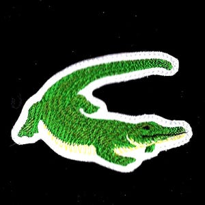 May include: Green embroidered alligator patch with a white outline.