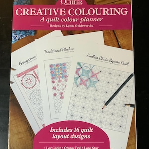May include: A quilt color planner titled "Creative Colouring" by Lynne Goldsworthy. The cover is pink and features the text "Today's Quilter". Inside are quilt layout designs, including Log Cabin, Orange Peel, and Lone Star.