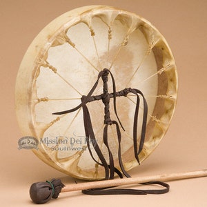 May include: A 14-inch diameter Native American hand drum with a brown leather lacing pattern and a wooden stick with a leather-wrapped head.