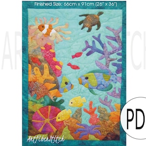 May include: A colorful quilt pattern featuring a variety of sea life, including a sea turtle, clownfish, and coral. The quilt is 26 inches by 36 inches.