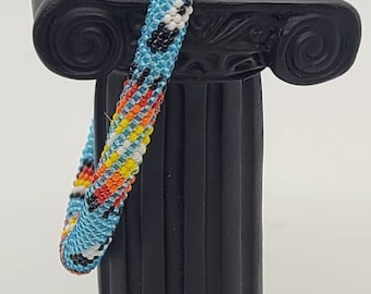 Beaded bracelets, Beaded bangles, Aqua blue, peyote stitched bracelet with fire colored geometric patterns and feather designs