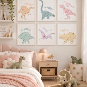 May include: Six framed wall art prints featuring floral-patterned dinosaurs labeled Spinosaurus, Brachiosaurus, Tyrannosaurus Rex, Stegosaurus, Pterodactylus, and Triceratops, displayed in a room with dinosaur-themed decor and plush toys.