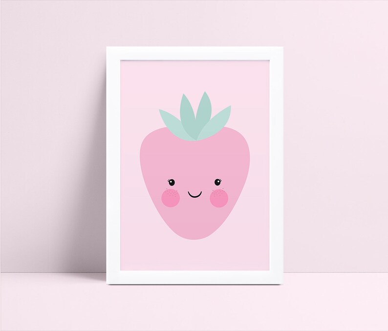 May include: A pink framed print with a cartoon strawberry with a happy face and green leaves on a pink background.