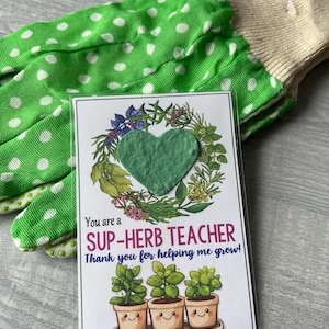 May include: A green and white polka dot gardening glove with a card that says "You are a SUP-HERB TEACHER Thank you for helping me grow!" with a small green heart-shaped seed paper packet and a drawing of three potted plants with happy faces. The card also includes instructions for planting the seed paper.