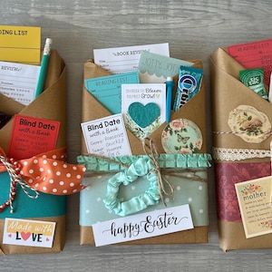 May include: Three gift-wrapped book bundles with various embellishments. Each bundle is wrapped in brown paper and decorated with ribbons, stickers, and cards. Contents include candy, pencils, and reading lists. One bundle has a "happy Easter" message.