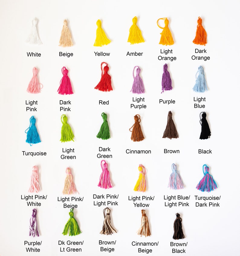 May include: A chart displaying 20 different colours of yarn tassels. The colours include white, beige, yellow, amber, light orange, dark orange, light pink, dark pink, red, light purple, purple, light blue, turquoise, light green, dark green, cinnamon, brown, black, light pink/white, light pink/beige, dark pink/light pink, light pink/yellow, light blue/light pink, turquoise/dark pink, purple/white, dark green/light green, brown/beige, cinnamon/beige, and brown/black.