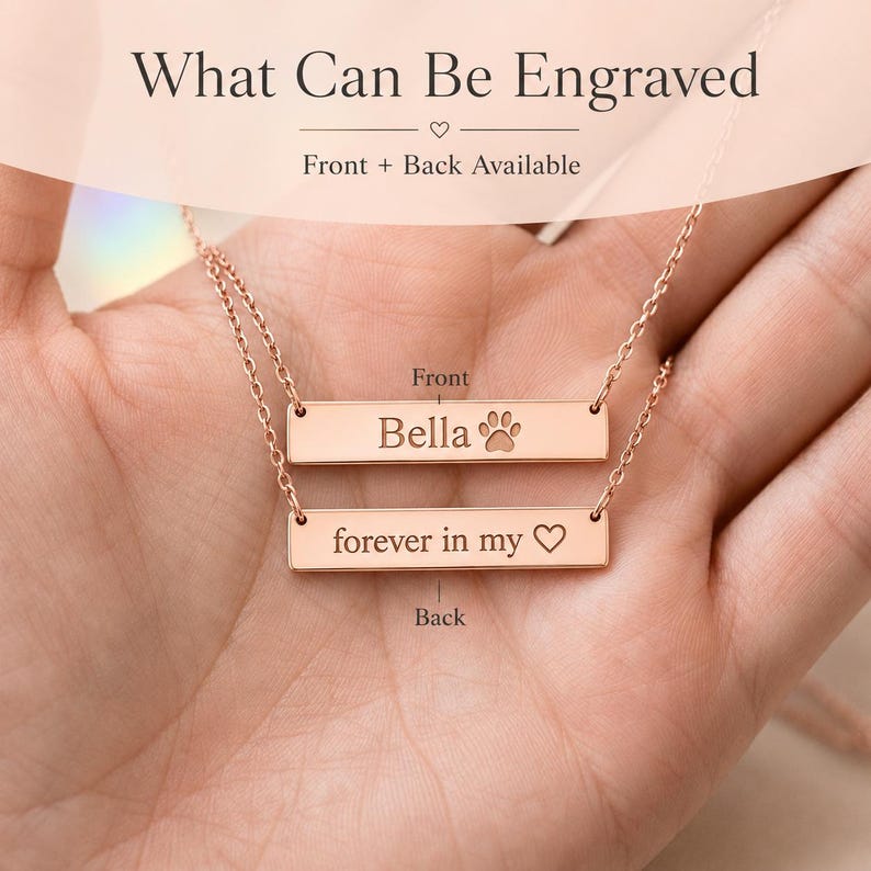 Front and back engraving example for paw print bar necklace, with Bella and paw print on front and memorial message on back.