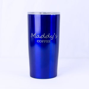 A blue stainless steel coffee mug engraved with Maddys Coffee is against a white background. Engraved insulated drink thermos, personalized drink container, personalized stainless steel mug for him, customized coffee mug for her