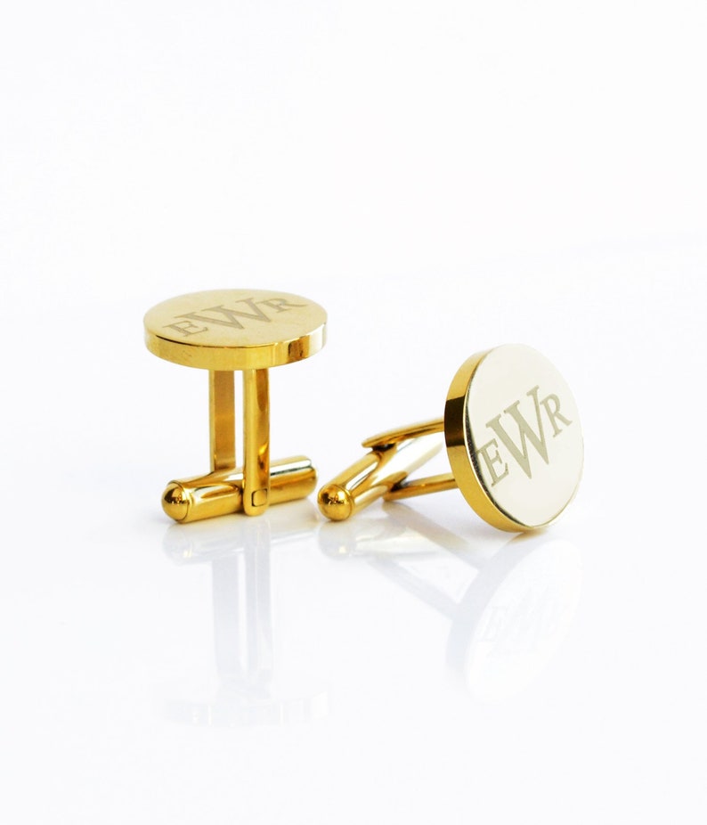 Circular 24K Gold Plated Steel Metal Cufflinks Customized with a serif font monogram with the initials E W R. Personalized Round Cufflinks for gifting Groomsmen, celebrating an anniversary, gift for Groom, Husband, Father of Bride or Father of Groom.