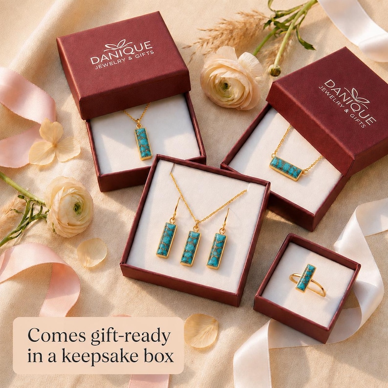 Gift-ready turquoise birthstone necklace displayed in Danique Jewelry boxes with matching jewelry pieces.