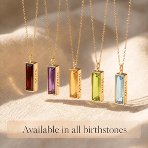 Birthstone bar necklaces shown in multiple gemstone colors with hidden side engraving, available for every birth month.