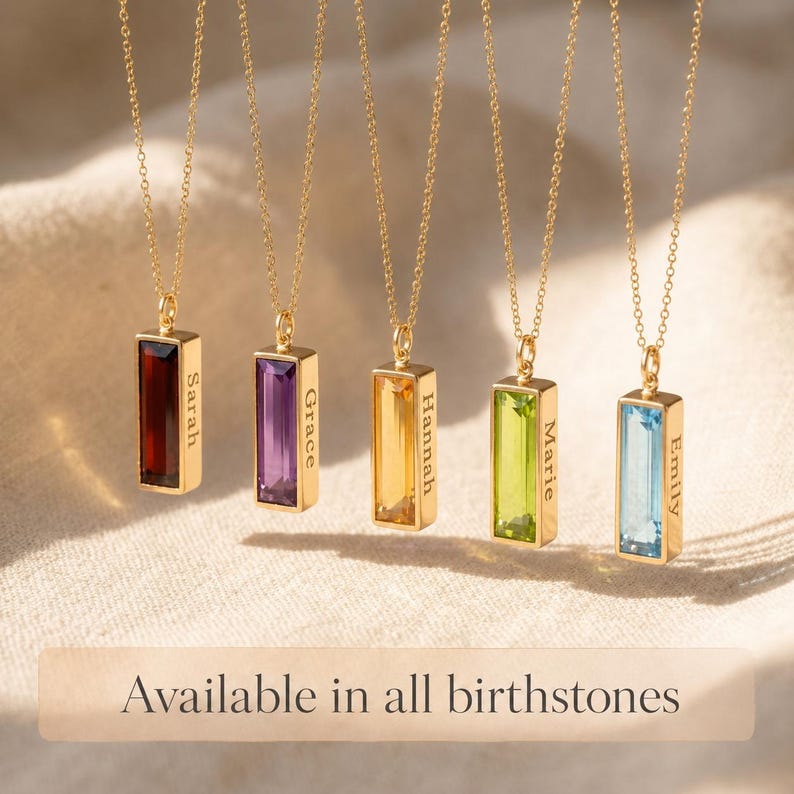 Birthstone bar necklaces shown in multiple gemstone colors with hidden side engraving, available for every birth month.