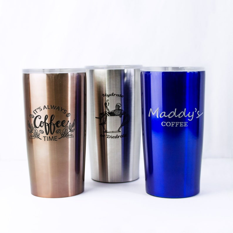 3 coffee tumblers in copper, blue, and stainless silver are all on a white background. Gift for coffee lover to go with coffee, mothers day gift for coffee mom, personalized coffee gift for dad, coffee dad fathers day gift, gift for coffee drinker
