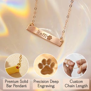 Close-up of gold bar necklace engraved with name ‘Raffi’ and paw print, shown with details highlighting premium solid bar pendant, precision deep engraving, and custom chain length. Personalized pet name jewelry by Danique Jewelry. Custom engraved dog or cat necklace made from 925 sterling silver, 14K gold, or rose gold filled. High-quality handmade memorial keepsake gift for pet owners, featuring durable engraving and minimalist design.