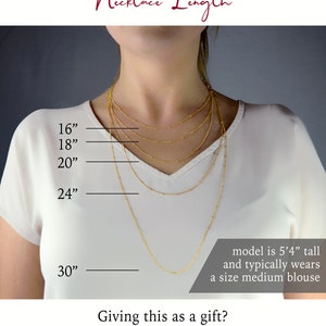 May include: A model wearing a white shirt with five gold necklaces of different lengths. The necklaces are labeled with measurements in inches: 16", 18", 20", 24", and 30". The text "Necklace Length" is at the top of the image. The text "model is 5'4" tall and typically wears a size medium blouse" is at the bottom of the image. The text "Giving this as a gift? - OUR MOST POPULAR LENGTH IS 18" LONG -" is at the bottom of the image.