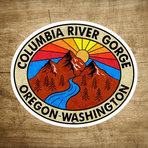 May include: A vintage-style sticker with a retro sun and mountain scene. The text reads "Columbia River Gorge Oregon-Washington".