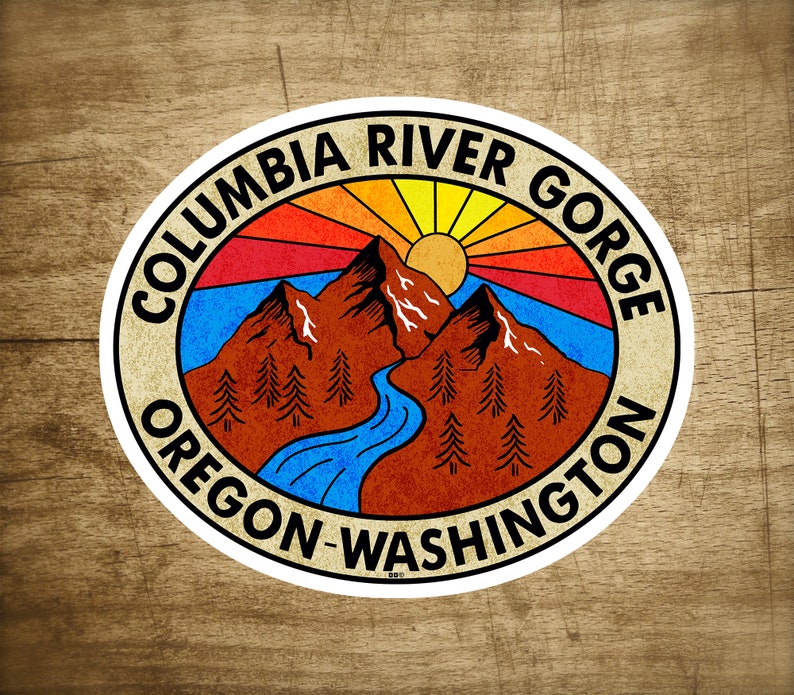 May include: A vintage-style sticker with a retro sun and mountain scene. The text reads "Columbia River Gorge Oregon-Washington".