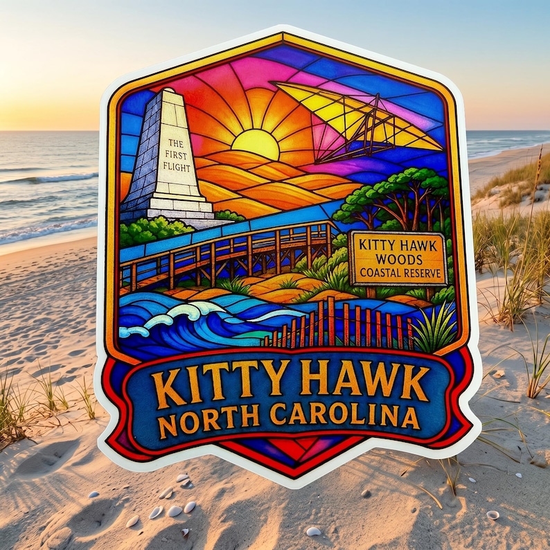 May include: A sticker featuring a stained-glass style illustration of Kitty Hawk, North Carolina. It depicts the Wright Brothers monument with the text THE FIRST FLIGHT, a hang glider, a wooden boardwalk, and a sign reading KITTY HAWK WOODS COASTAL RESERVE.