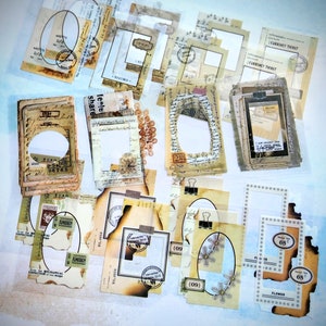 May include: A collection of vintage-style paper ephemera, including tags, labels, and frames. The pieces feature aged paper textures, stamps, and handwritten script. Some have oval cutouts, floral designs, and the numbers "68" and "09".