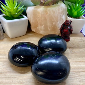 Obsidian crystal palm stone